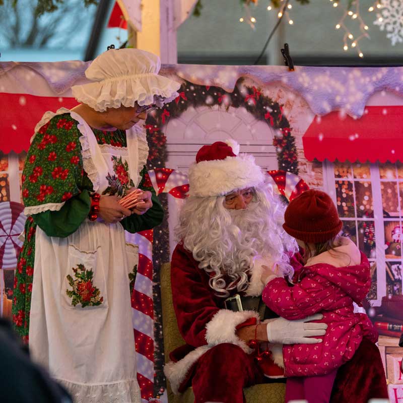 child sitting on Santa Claus lap